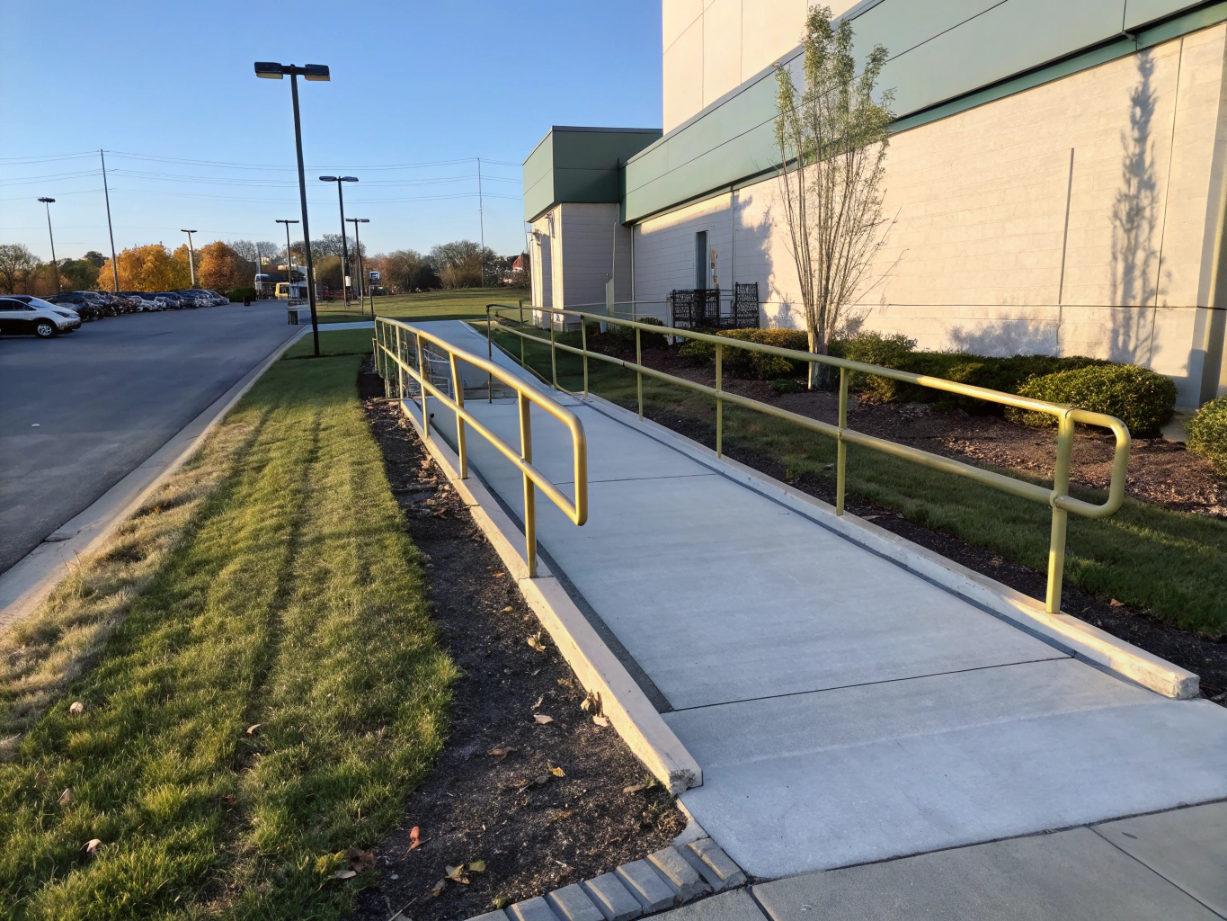 ADA compliant zero-threshold concrete ramp and accessible entry adaptation